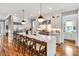 Spacious kitchen with a large island, stainless appliances, and pendant lighting at 1801 Clifton Pines Dr, Cary, NC 27519