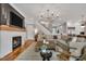 Inviting living room with fireplace, comfortable seating, and open access to other areas at 1801 Clifton Pines Dr, Cary, NC 27519