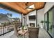 Relaxing outdoor patio with a ceiling fan, fireplace, television and plenty of comfortable seating at 1801 Clifton Pines Dr, Cary, NC 27519