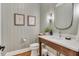 Stylish powder room with modern fixtures, wall paneling, and decor at 1801 Clifton Pines Dr, Cary, NC 27519