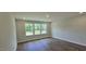 Inviting bedroom with hardwood floors and natural light from a window at 20 Bold Dr, Youngsville, NC 27596