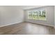 Bright bedroom features luxury vinyl plank flooring and a large window at 20 Bold Dr, Youngsville, NC 27596