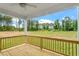 Wooden deck with a wooden railing overlooking the green backyard at 20 Bold Dr, Youngsville, NC 27596