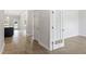 Spacious hallway featuring beautiful wood floors and natural light at 20 Bold Dr, Youngsville, NC 27596