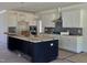 Spacious kitchen featuring a large island, white cabinets, and stainless steel appliances at 20 Bold Dr, Youngsville, NC 27596