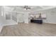 Open-concept living space features a modern kitchen with a central island and coffered ceilings at 20 Bold Dr, Youngsville, NC 27596