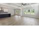 Bright open-concept living space with large windows and view to the backyard at 20 Bold Dr, Youngsville, NC 27596