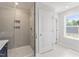 Shower in the primary bathroom showcasing a glass enclosure and a tiled shower at 20 Bold Dr, Youngsville, NC 27596