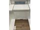 Showcasing a white cabinet door, quartz countertop, and wood-look flooring at 20 Bold Dr, Youngsville, NC 27596