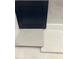 An arrangement with a navy blue cabinet door and coordinating countertop samples at 20 Bold Dr, Youngsville, NC 27596