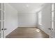 Bright office space with wood floors and natural light from a large window at 20 Bold Dr, Youngsville, NC 27596