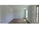 Versatile room with hardwood floors and natural light, perfect for a home office or study at 20 Bold Dr, Youngsville, NC 27596