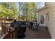 Outdoor deck features multiple cooking appliances, lounge chairs and a fire pit perfect for outdoor entertainment at 2021 Terri Creek Dr, Fuquay Varina, NC 27526