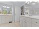Bathroom with double vanity, neutral walls, and walk-in closet with a shower at 2021 Terri Creek Dr, Fuquay Varina, NC 27526