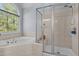 Bathroom with a garden tub and a clear glass walk-in shower at 2021 Terri Creek Dr, Fuquay Varina, NC 27526