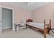 Bedroom with a single bed, desk, neutral paint, and a doorway leading to a closet at 2021 Terri Creek Dr, Fuquay Varina, NC 27526