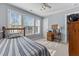 Bedroom with a single bed, a desk, natural light, and neutral paint at 2021 Terri Creek Dr, Fuquay Varina, NC 27526