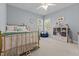 Bright bedroom featuring a gold metal bed frame, stuffed animals and lots of natural light at 2021 Terri Creek Dr, Fuquay Varina, NC 27526