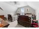 Bedroom with two twin beds, ceiling fan, neutral paint, and a large dresser at 2021 Terri Creek Dr, Fuquay Varina, NC 27526