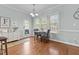 Cozy breakfast nook with natural light, hardwood floors, and a charming view of the outdoors at 2021 Terri Creek Dr, Fuquay Varina, NC 27526