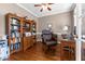Home office featuring hardwood floors, a ceiling fan and wooden furniture at 2021 Terri Creek Dr, Fuquay Varina, NC 27526