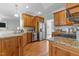 Updated kitchen with wooden cabinets, granite countertops and stainless steel appliances at 2021 Terri Creek Dr, Fuquay Varina, NC 27526