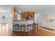 Open kitchen counter with barstool seating and cabinetry detail, blending style and functionality for gatherings at 2021 Terri Creek Dr, Fuquay Varina, NC 27526