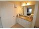 Bathroom featuring a granite vanity, cabinets, and a mirror at 2500 Friedland Pl # 101, Raleigh, NC 27617