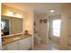 Bright bathroom with granite countertop, toilet, and walk-in shower at 2500 Friedland Pl # 101, Raleigh, NC 27617
