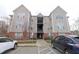 Well-maintained multi-story condo building with brick accents and visible parking at 2500 Friedland Pl # 101, Raleigh, NC 27617