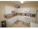 Efficient kitchen with white cabinetry, granite countertops, and modern appliances, offering a functional and stylish cooking space at 2500 Friedland Pl # 101, Raleigh, NC 27617