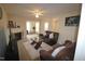 Inviting living room showcasing a fireplace, comfy brown leather couches, and glass tables at 2500 Friedland Pl # 101, Raleigh, NC 27617