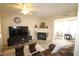 Inviting living room with fireplace and cozy brown leather couches at 2500 Friedland Pl # 101, Raleigh, NC 27617