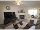 Comfortable living room features a fireplace and stylish glass tables at 2500 Friedland Pl # 101, Raleigh, NC 27617