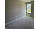 Bedroom featuring plush carpet and a large window allowing lots of natural light at 255 Constellation Ct, Benson, NC 27504