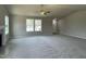Expansive living room with cozy carpet, fireplace, and bright windows that provide an inviting atmosphere at 255 Constellation Ct, Benson, NC 27504