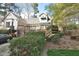 Back exterior showcasing a spacious deck and lush landscaping, enhancing the property's curb appeal at 29 Mocking Ln, Rocky Mount, NC 27804