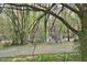 Backyard view surrounded with trees and nature with a small river at 29 Mocking Ln, Rocky Mount, NC 27804