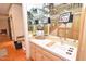 Home bar features mirrors, glass shelving, sink, and storage cabinets at 29 Mocking Ln, Rocky Mount, NC 27804