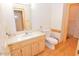 Bathroom with wood vanity, modern fixtures, and a comfort height toilet at 29 Mocking Ln, Rocky Mount, NC 27804