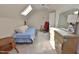 Bedroom with carpet, skylight, rocking chair, and dresser with mirror at 29 Mocking Ln, Rocky Mount, NC 27804