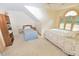 Bright bedroom with two beds, shelves, ceiling fan, and natural light from windows at 29 Mocking Ln, Rocky Mount, NC 27804