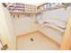 Walk-in closet features shelving, wooden trim, and a tile floor at 29 Mocking Ln, Rocky Mount, NC 27804