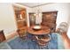 Dining room with hardwood furniture and blue carpet at 29 Mocking Ln, Rocky Mount, NC 27804