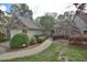 Charming stone and siding home with a well-manicured lawn and lovely landscaping at 29 Mocking Ln, Rocky Mount, NC 27804