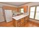 Bright kitchen features wood cabinets, stainless appliances, and breakfast bar at 29 Mocking Ln, Rocky Mount, NC 27804