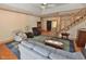 Cozy living room with a staircase, comfortable seating, and hardwood floors at 29 Mocking Ln, Rocky Mount, NC 27804