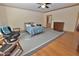 Spacious main bedroom with ceiling fan and adjacent bathroom and dressing area at 29 Mocking Ln, Rocky Mount, NC 27804