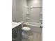 Full bathroom featuring a modern vanity, toilet, and shower-tub combination at 3007 Honeymyrtle Ln, Durham, NC 27703