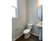 Half bathroom featuring modern fixtures and a pedestal sink at 3007 Honeymyrtle Ln, Durham, NC 27703